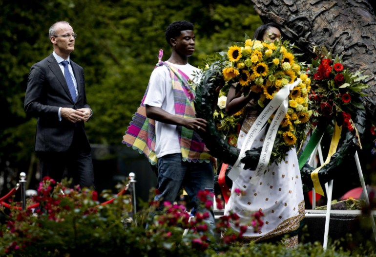 Klaas Knot (L), president of the De Nederlandsche Bank, attends a ceremony at the National Monument to Slavery Past, during the national commemoration of the Dutch slavery past in Amsterdam