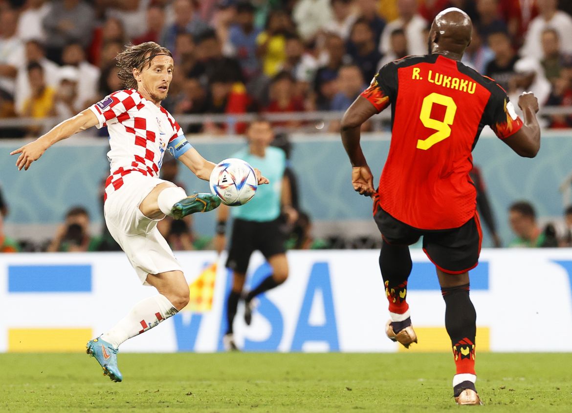 Luka Modric (L) of Croatia in action against Romelu Lukaku (R)