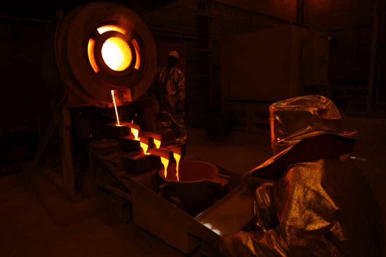 Gold pours from a crucible at the Taparko gold mine site in northern Burkina Faso
