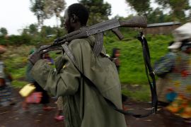 A Congolese rebel fighter with a gun