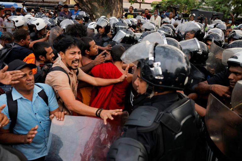 Demonstrators shout at Sri Lankan police officers during an anti-government protest by trade unions, student movements, and civil organisations, including the main opposition parties, amid the country's economic crisis, in Colombo, Sri Lanka, November 2, 2022. REUTERS/ Dinuka Liyanawatte