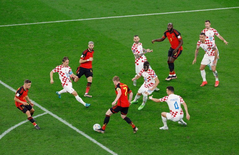 Belgium's Kevin De Bruyne in action with Croatia's Ivan Perisic, Josko Gvardiol and Luka Modric 
