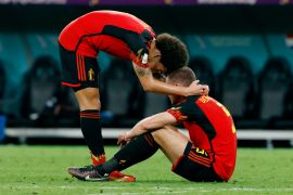 Belgium's Axel Witsel and Jan Vertonghen look dejected after the match as Belgium are eliminated from the World Cup