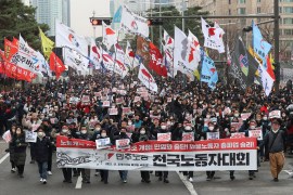 South Korean workers march during a rally in support of the ongoing strike by truckers near the National Assembly in Seoul, South Korea.