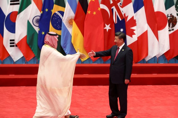 China's President Xi Jinping shakes hands with Saudi Arabia's Deputy Crown Prince Mohammed bin Salman
