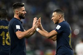 France's Kylian Mbappe celebrates scoring their second goal with Olivier Giroud.