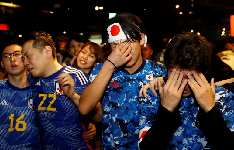 Soccer Football - FIFA World Cup Qatar 2022 - Fans in Tokyo watch Japan v Croatia - Tokyo, Japan - December 6, 2022 Japan fans react as they watch the penalty shootout at the Bee bar REUTERS/Kim Kyung-Hoon TPX IMAGES OF THE DAY
