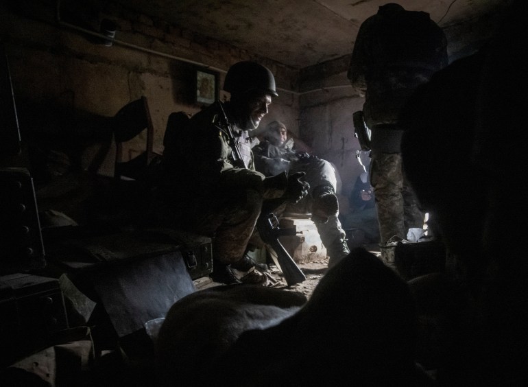Ukrainian service members rest in their shelter in Bakhmut, as Russia's attack on Ukraine continues, Bakhmut, in Donetsk region, Ukraine, December 9, 2022. REUTERS/Yevhen Titov