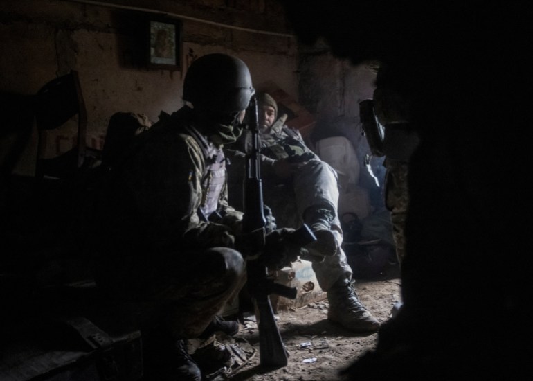 Ukrainian service members rest in their shelter in Bakhmut, as Russia's attack on Ukraine continues, in Donetsk region, Ukraine December 9, 2022. REUTERS/Yevhen Titov