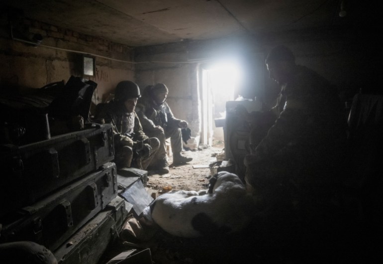 Ukrainian service members rest in their shelter in Bakhmut, as Russia's attack on Ukraine continues, in Donetsk region, Ukraine, December 9, 2022. REUTERS/Yevhen Titov