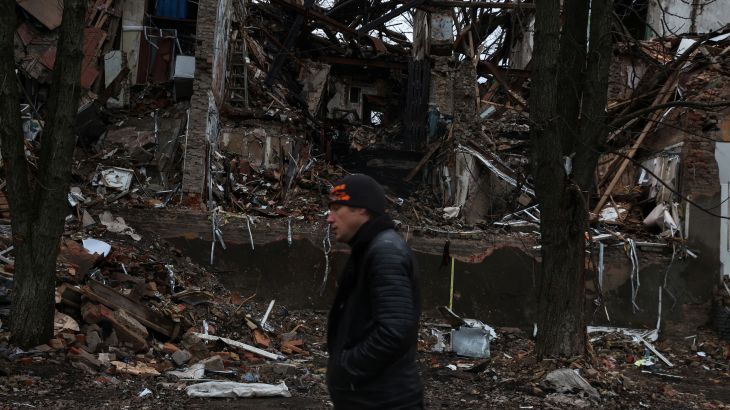 A man walks down a war-torn street, as Russia's attack on Ukraine continues, in the city Slovyansk, Donetsk region of Ukraine, December 12, 2022. REUTERS/Shannon Stapleton