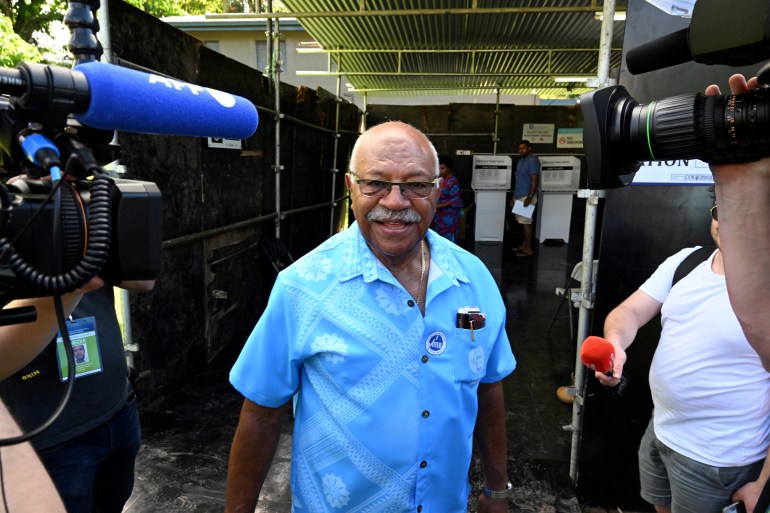 Sitiveni Rabuka leaves after voting at a polling station during the Fijian general election in Suva, Fiji
