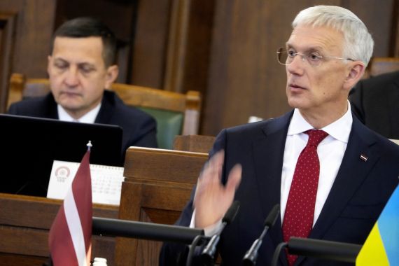 Latvian Prime Minister and candidate Krisjanis Karins addresses Parliament before its vote for a new government in Riga