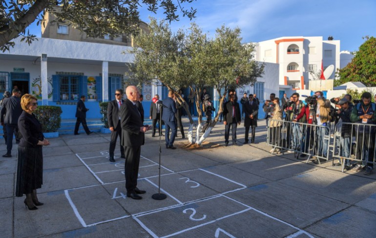 Tunisia's President Kais Saied speaks outside a polling station during parliamentary election in Tunis, Tunisia