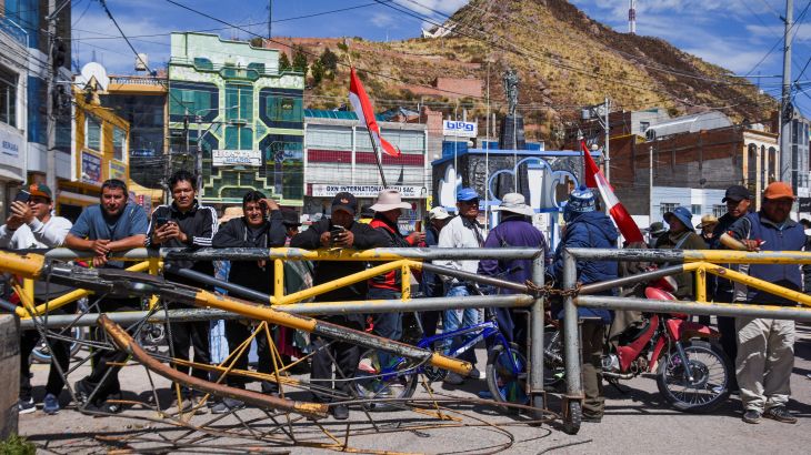 Protesters block a border crossing in Peru