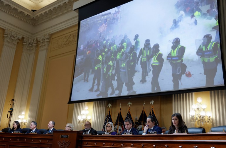 rioters on tv screen at Jan 6th committee hearing