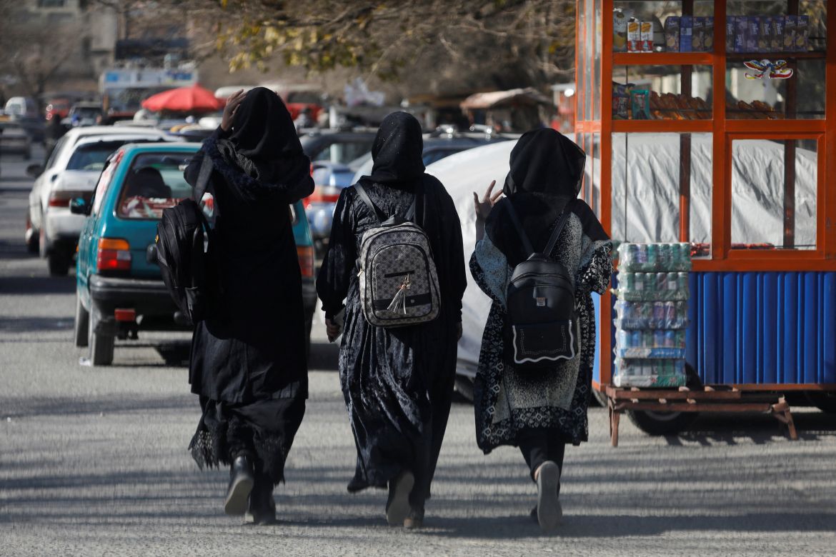 Afghan female students walk