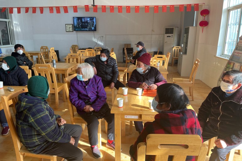 Elderly residents wait after receiving a dose of a vaccine against coronavirus disease (COVID-19), during a government-organized visit to a vaccination center in Zhongmin village on the outskirts of Shanghai, China December 21, 2022. REUTERS/Brenda Goh