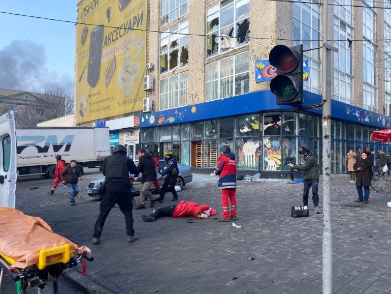 SENSITIVE MATERIAL. THIS IMAThe body of a person killed during a Russian military strike is seen on a street.