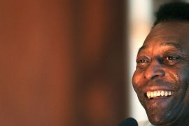 Pele smiles during a news conference