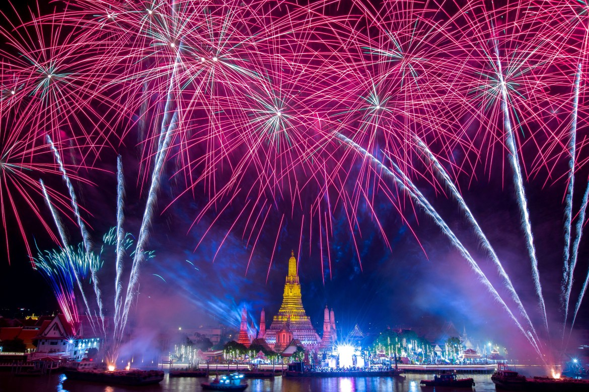 Fireworks explode over Wat Arun of the temple of dawn during the New Year celebrations, in Bangkok.