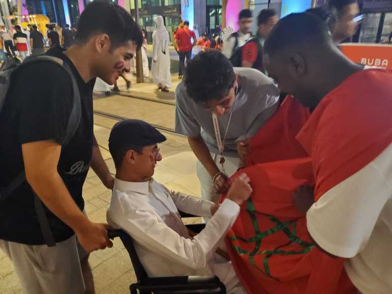 Morocco fans and supporters celebrate their team's win on the streets of Doha, Qatar.