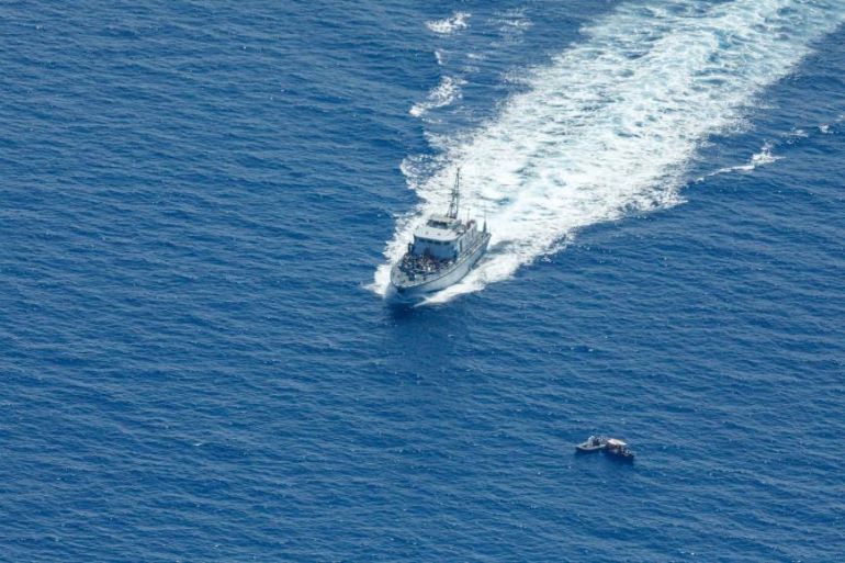 A Libyan Coast Guard vessels tries to intercept a boat