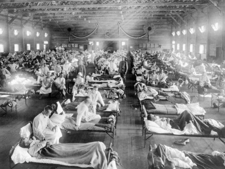 Influenza victims crowd into an emergency hospital at Camp Funston, a subdivision of Fort Riley, Kansas, the US in 1918 [File:AP]