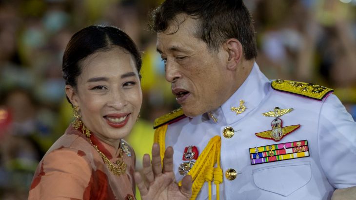 Thai King Maha Vajiralongkorn gestures as he speaks with Princess Bajrakitiyabha
