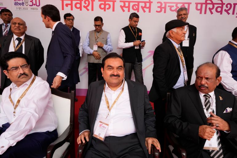 Industrialist Gautam Adani, center, sits for a group photograph during the Ground Breaking Ceremony @3.0 of the UP Investors Summit Lucknow in the northern Indian state of Uttar Pradesh, India, Friday, June 3, 2022. (AP Photo/Rajesh Kumar Singh)
