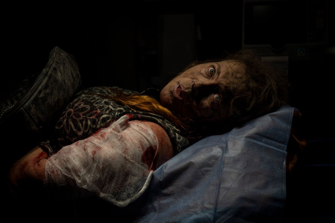 A resident wounded after a Russian attack lies inside an ambulance before being taken to a hospital in Kherson, southern Ukraine, Thursday, Nov. 24, 2022. (AP Photo/Bernat Armangue)