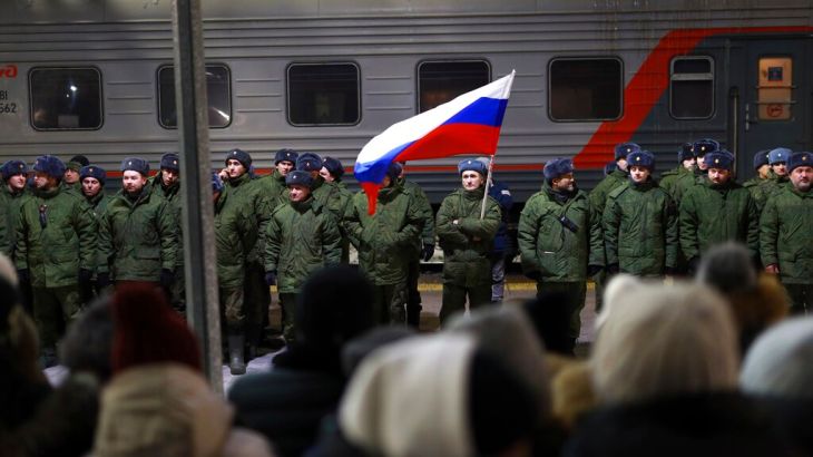 Russian soldiers who were recently mobilised stand at a ceremony before boarding a train at a railway station in Tyumen, Russia, on December 2, 2022