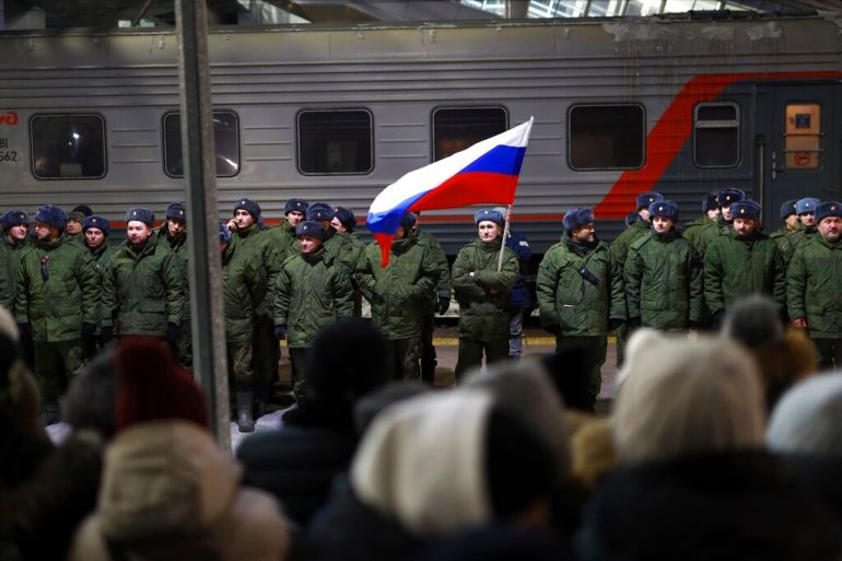 Russian soldiers who were recently mobilised stand at a ceremony before boarding a train at a railway station in Tyumen, Russia, on December 2, 2022