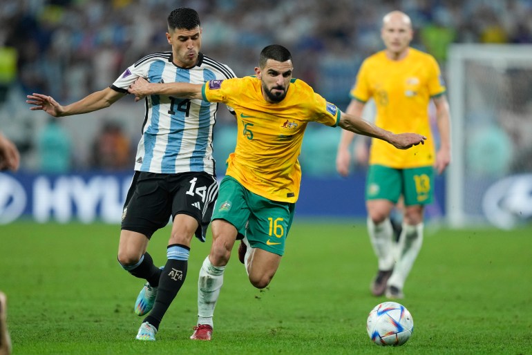 Australia's Aziz Behich and Argentina's Exequiel Palacios battle for the ball during their World Cup Round of 16 football match.