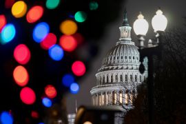 Holiday lights twinkle in front of US Capitol building