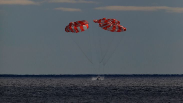 The Orion spacecraft for the Artemis I mission splashes down in the Pacific Ocean