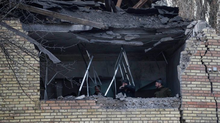 People check a tax office building, that was heavily damaged in Russian shelling, in Kyiv, Ukraine, Dec 14, 2022