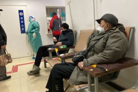 People receive IV drips at the the fever clinic in the Puren Hospital in Beijing, Wednesday, Dec. 14, 2022. China's National Health Commission scaled down its daily COVID-19 report starting Wednesday in response to a sharp decline in PCR testing since the government eased antivirus measures after daily cases hit record highs. (AP Photo/Dake Kang)