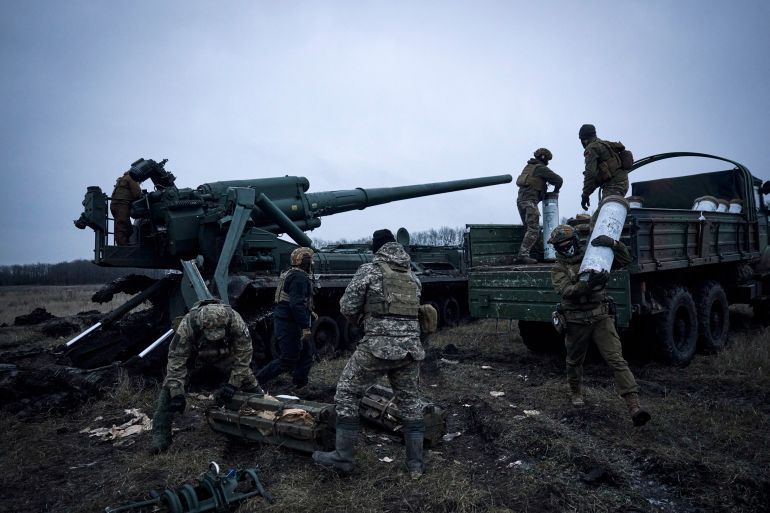 Ukrainian soldiers prepare to fire a Pion artillery system at Russian positions near Bakhmut, Donetsk
