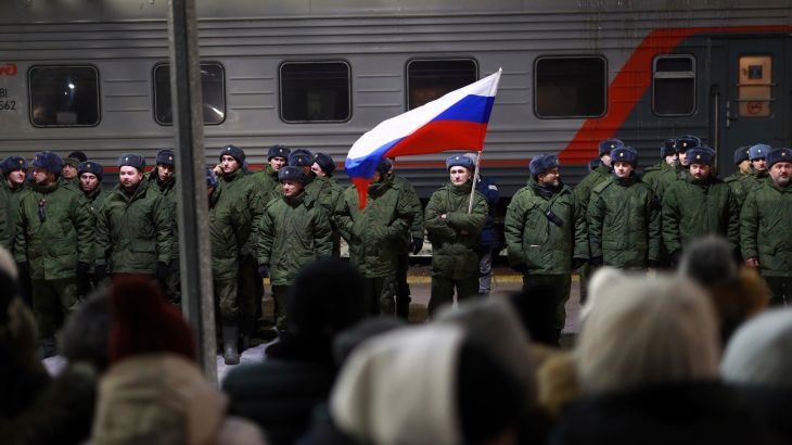 Soldiers who were recently mobilized by Russia for the military operation in Ukraine stand at a ceremony before boarding a train at a railway station in Tyumen, Russia, December 2, 2022