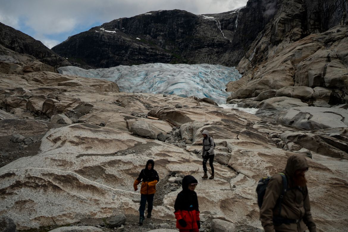 Tourists hike to visit the Nigardsbreen glacier