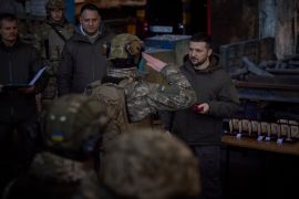 President Zelenskyy awarding soldiers with medals.