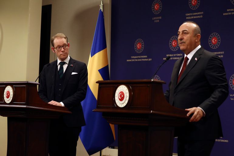 Turkey's Foreign Minister Mevlut Cavusoglu, right, and Sweden's Foreign Minister Tobias Billstrom