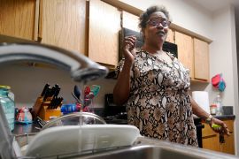 Water trickles out of a faucet in a woman's apartment in Jackson, Mississippi.
