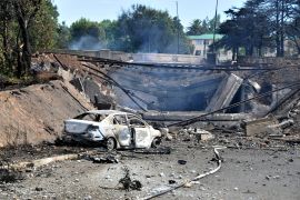 A burned out vehicle marks the spot where a gas tanker exploded under a bridge in Boksburg, east of Johannesburg, South Africa.
