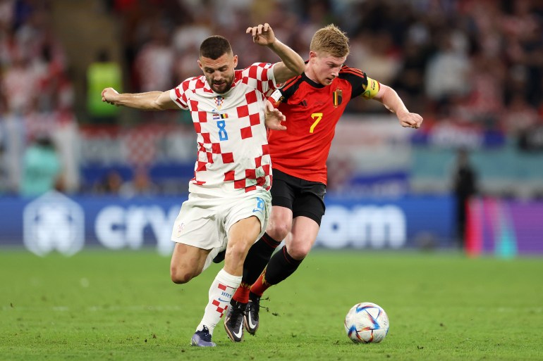 Croatia battles for possession with Kevin De Bruyne of Belgium