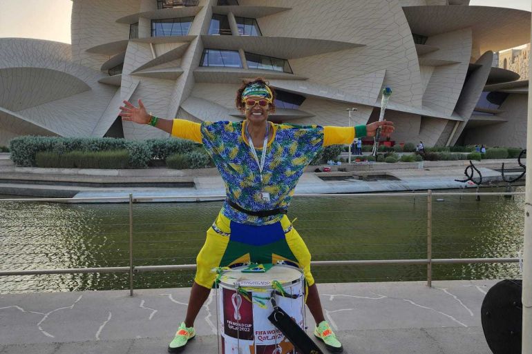 Wallace Leite standing in front of his drum outside the Qatar National Museum.