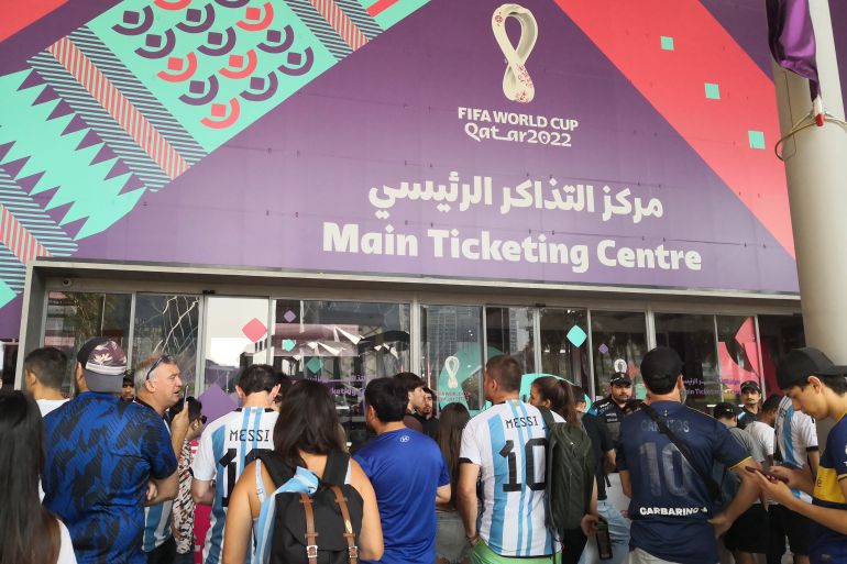 Argentina fans stand outside the main ticketing office in Doha hoping to find tickets for the final against France