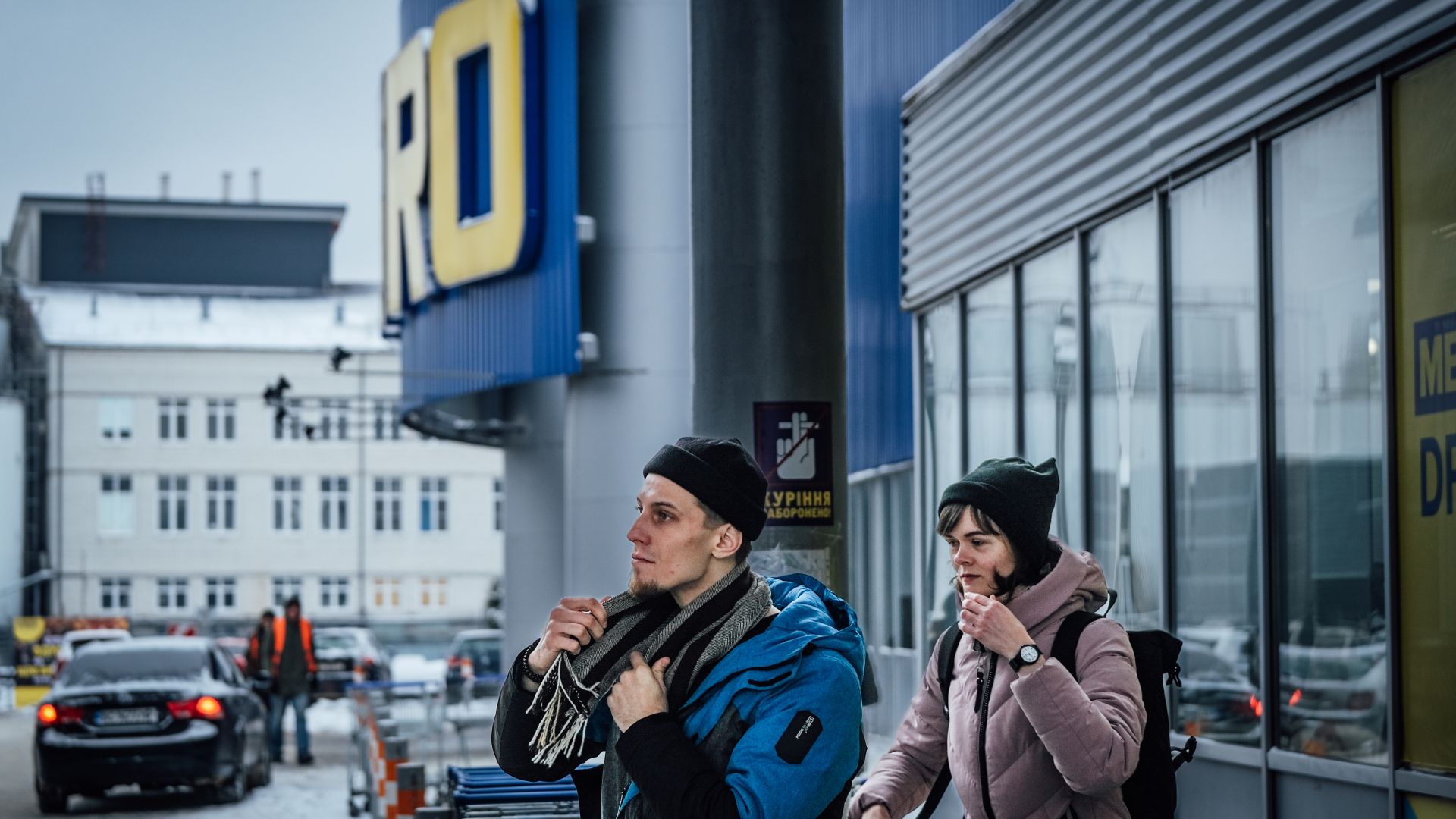 Oleksandr and Iryna outside a supermarket