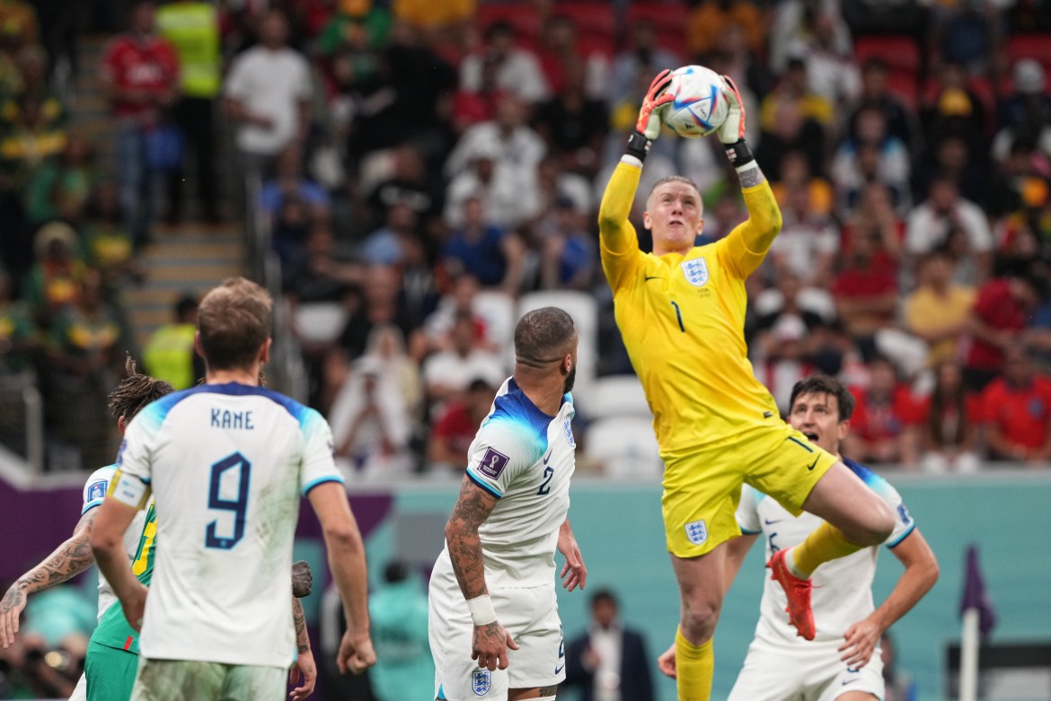 English keeper Jordan Pickford jumps to make a save.